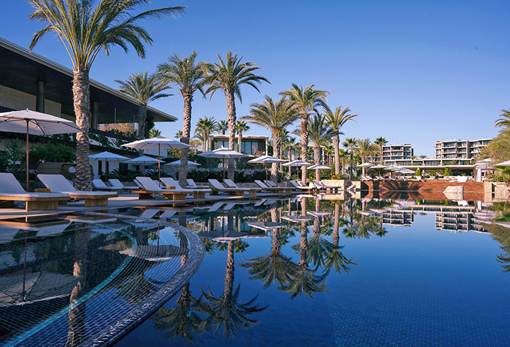 luxury pool with lounge chairs