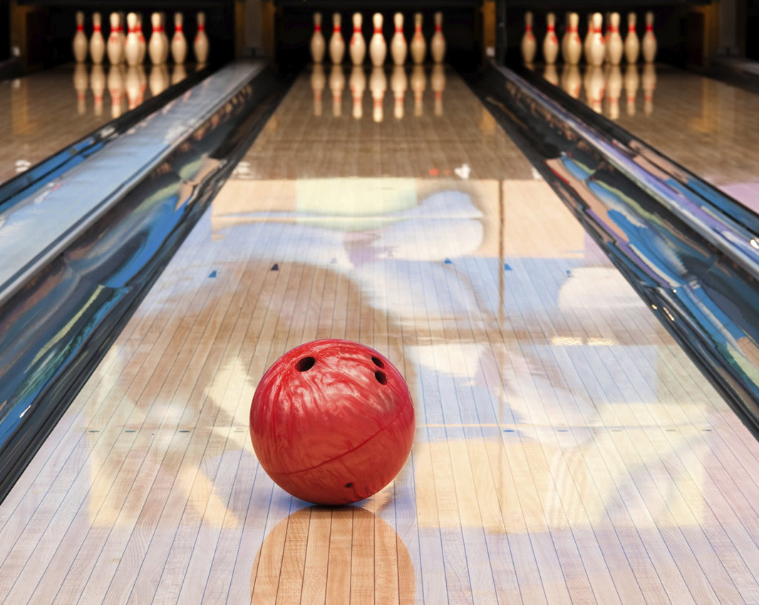 bowling ball placed on bowling alley