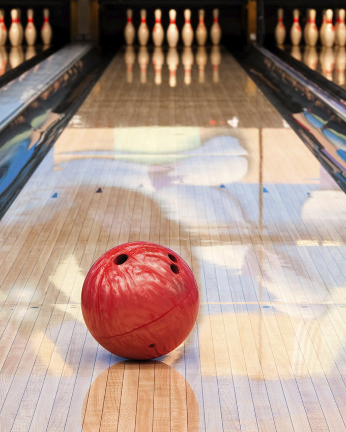 bowling ball placed on bowling alley
