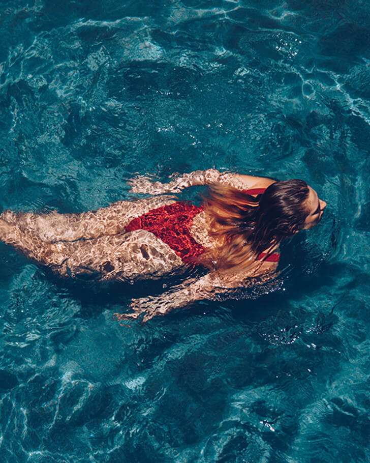 Woman swimming in pool